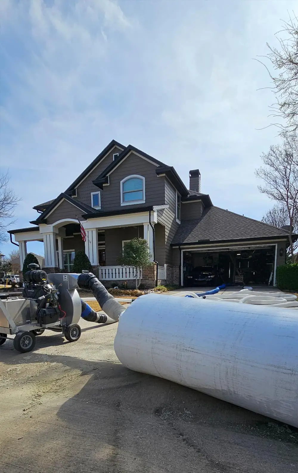 Insulation vacuum bag with collar attachment on house exterior