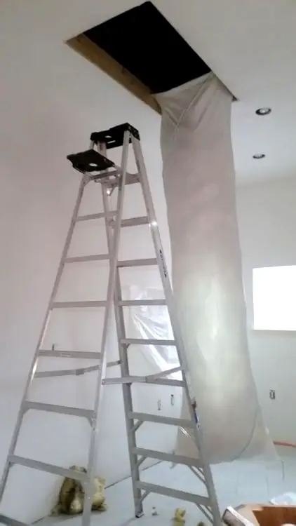 Multipurpose insulation bag used as trash chute on residential removal job