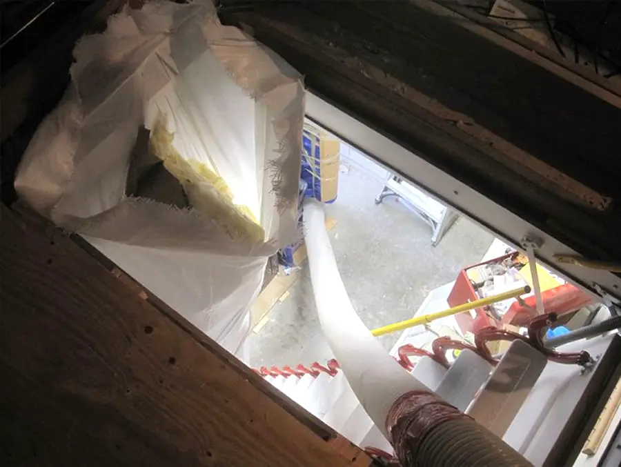 Insulation removal bag configured as trash chute from second story